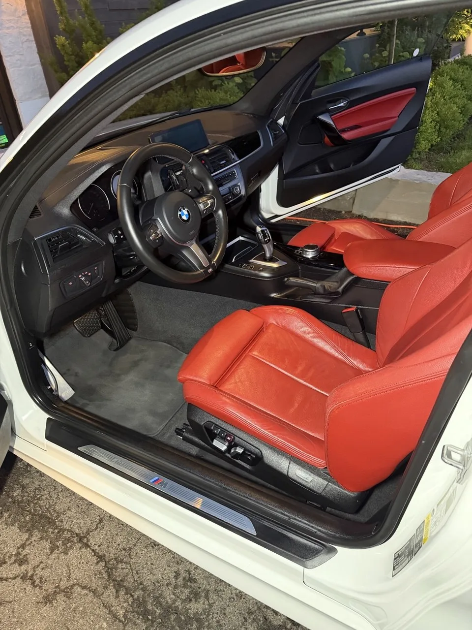 BMW M2 interior detailing Toronto — red leather seats